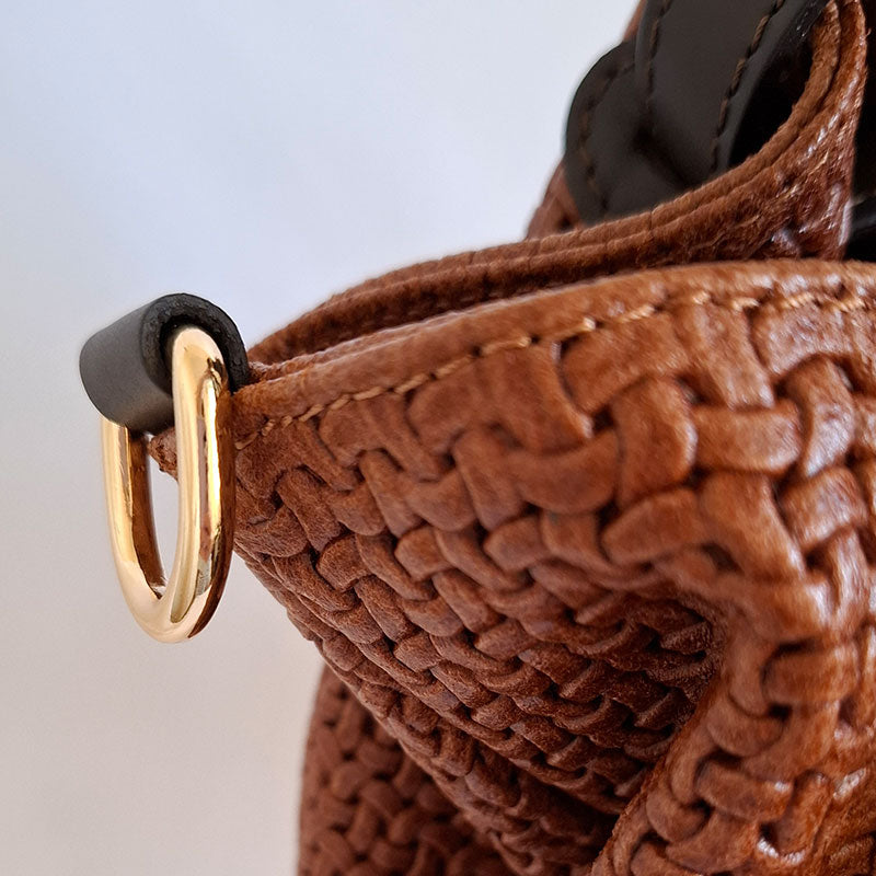 Close up of the Elegant and Luxurious gold tone hardware hook to attach removable shoulder strap in leather of  the TL Keyluck Tote Bag by Montipi Australia a luxurious designer bag handcrafted with premium Italian leather