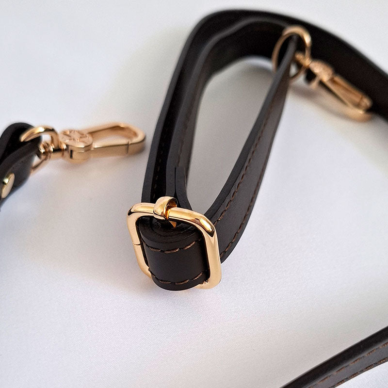 Close up of the Luxurious gold tone hardware adjustable parts of the adjustable shoulder strap in leather of  the TL Keyluck Tote Bag by Montipi Australia offering versatility to carry as shoulder bag signature of a luxurious designer bag meticulously handcrafted with premium details