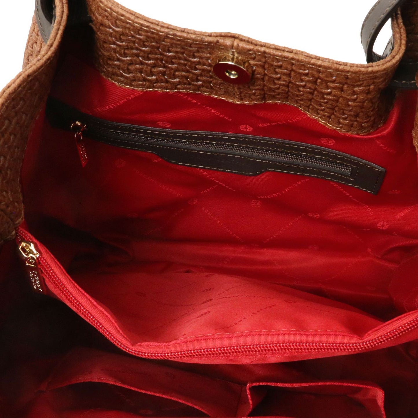 Close up of the Luxurious large organised compartment with red interior and multiple internal zipped pockets and side pockets of the TL Keyluck Tote Bag in cognac leather by Montipi Australia versatile convenient and durable with luxurious red fabric signature of premium designer bag