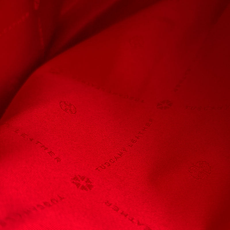 Close up of the Luxurious red interior branded design of the TL Keyluck Tote Bag by Montipi Australia with durable luxurious fabric branded tuscany leather signature of premium luxury designer bag