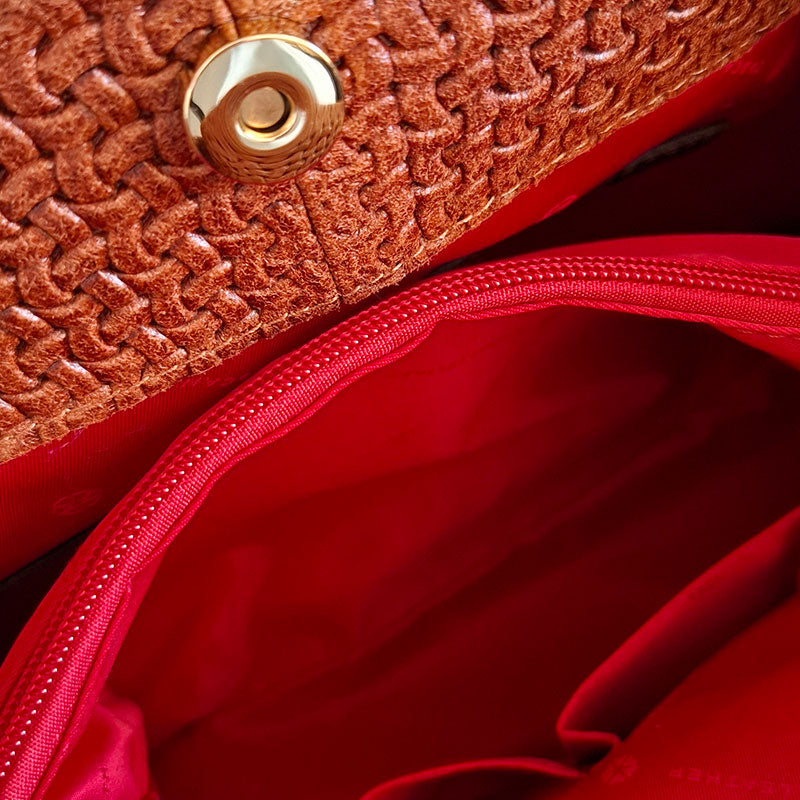 Close up of the Luxurious red interior design of the TL Keyluck Tote Bag in cognac leather by Montipi Australia with luxurious gold tone hardware magnetic closure red interior with zipped pocket and side pockets signature of premium designer bag
