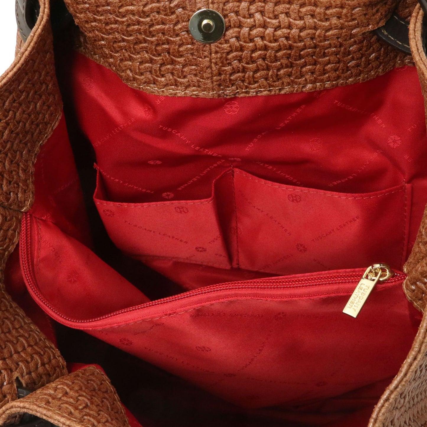 Close up of the Luxurious red interior with large organised compartment with central internal zipped pocket and side pockets of the TL Keyluck Tote Bag in cognac leather by Montipi Australia smart and convenient design to organise and quickly access all your essentials with luxurious red fabric signature of premium designer bag