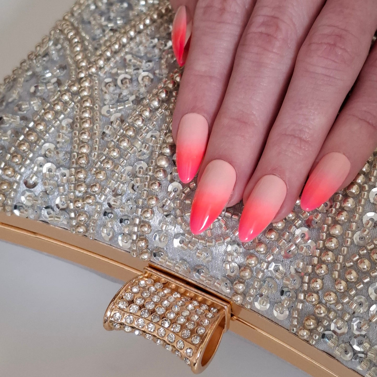 Luxe Silver Wedding Clutch Bag detailed gold tone hasp with crystal and intricate silver beaded design with silver sequin with pink Ombre nails the perfect match by Montipi Australia