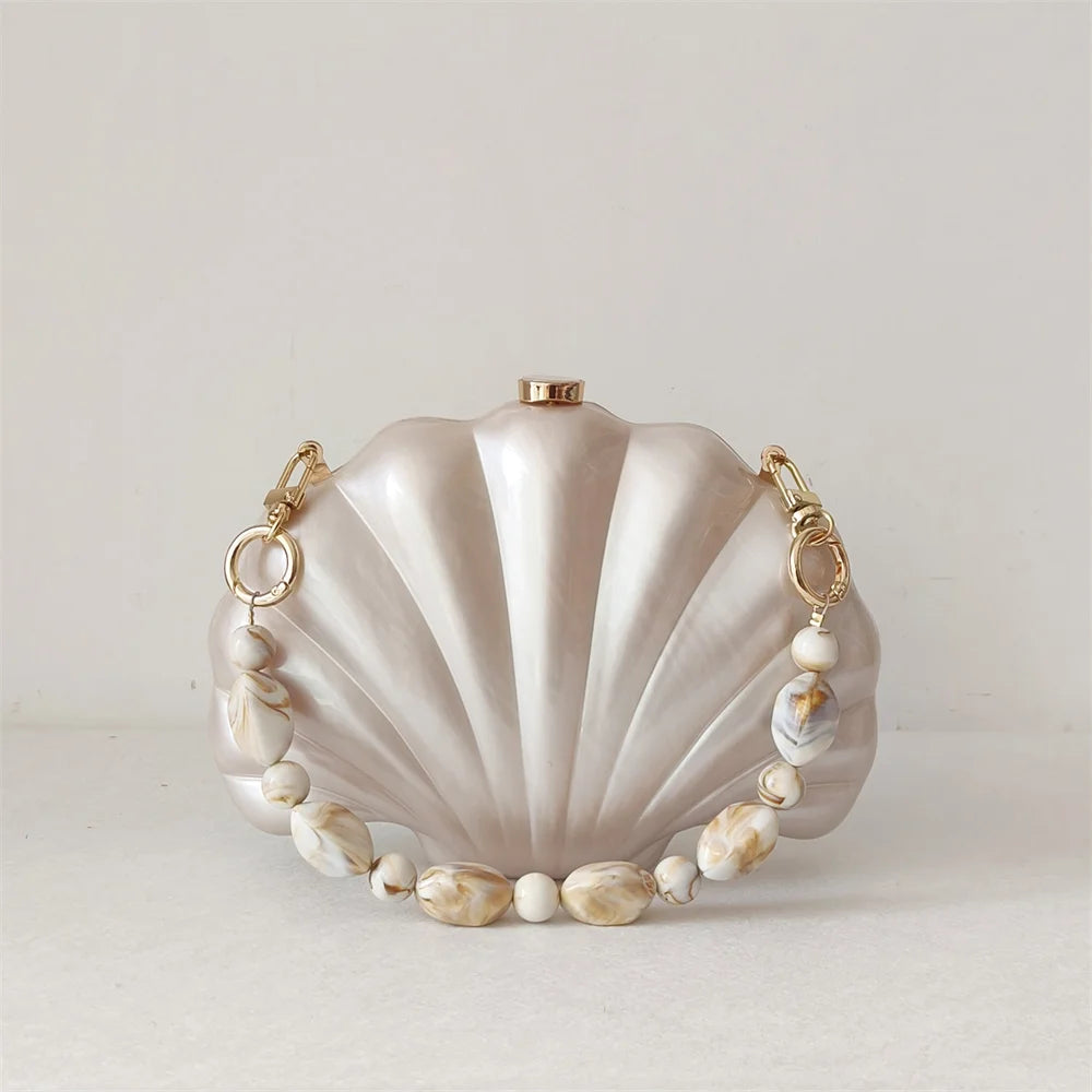 Elegant Mermaid Pearl Shell Clutch Bag with chic beaded handles resembling marble stones and gold tone hardware by Montipi Australia