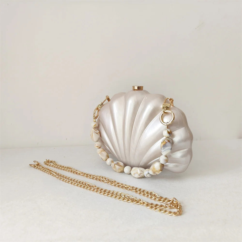 Elegant and chic Mermaid Pearl Shell Clutch Bag with removable beaded handle and gold chain shoulder strap by Montipi Australia