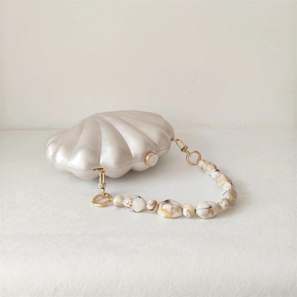 Elegant and original Mermaid Pearl Shell Clutch Bag with chic beaded handles resembling marble stones and gold tone hardware by Montipi Australia