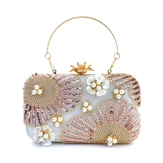 Elegant clutch bag with floral and beaded design with pearls and sequins with gold hasp a chic and dreamy statement bag to dress up for wedding or celebrations by Montipi Australia