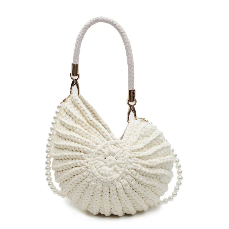 Fossil Seashell Bag in beige cream white  soft woven cotton with shell shape by Montipi, styled in earthy beach tones – perfect for boho luxe, coastal chic, and summer outfits.