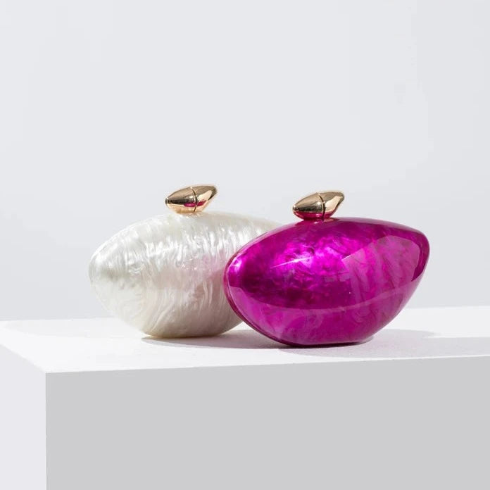 Hot pink and white pearl seashell clutch bag with a dreamy pearl acrylic finish, gold hasp closure, and chain strap – perfect for weddings, soirées, and beachside style by Montipi Australia