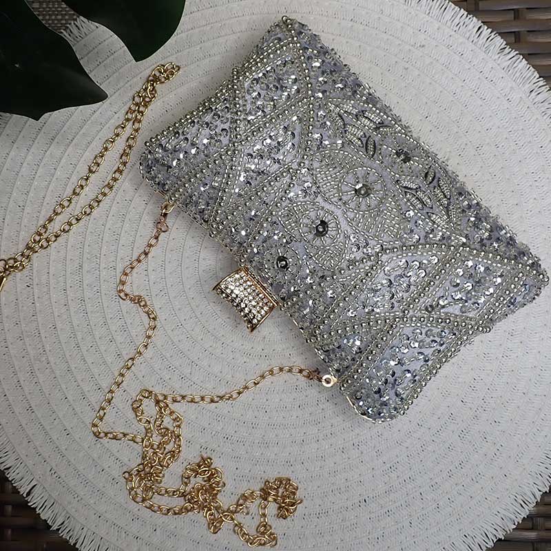 Luxe Silver Wedding Clutch Bag with intricate silver beaded design and silver sequin with handle and removable chain strap perfect for elegant weddings by Montipi Australia