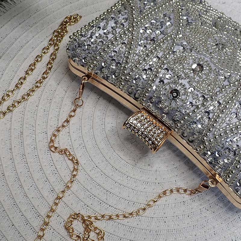 Luxe Silver Wedding Clutch Bag with intricate silver beaded design and silver sequin and elegant gold tone hardware perfect as wedding clutch bag by Montipi Australia