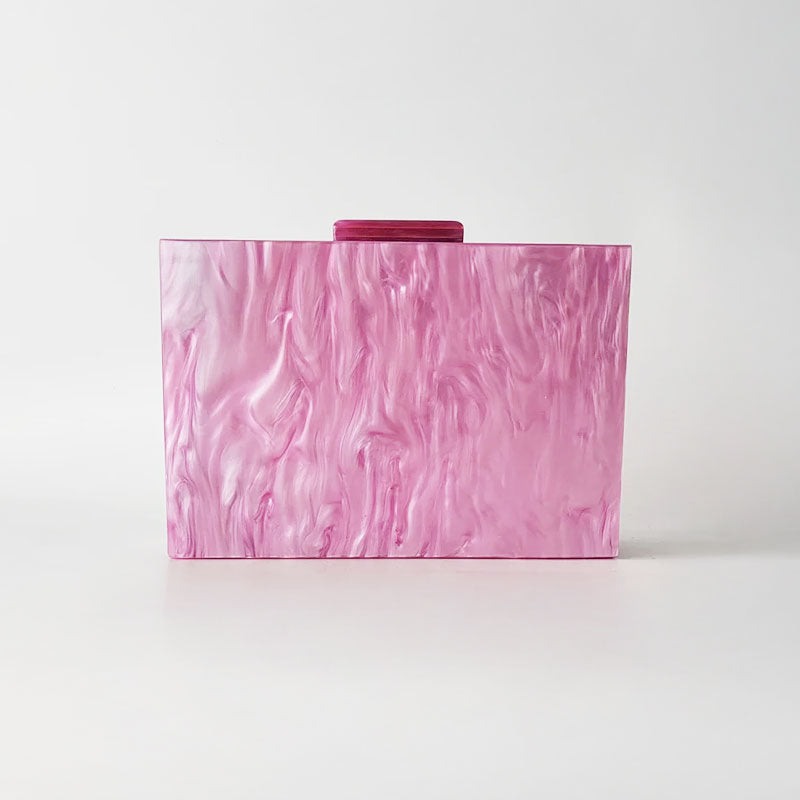 Pink Mirage Acrylic Clutch Bag featuring a striped pearl acrylic finish and colourful resin chain handle – perfect for weddings, resort chic, and boho luxe outfits.