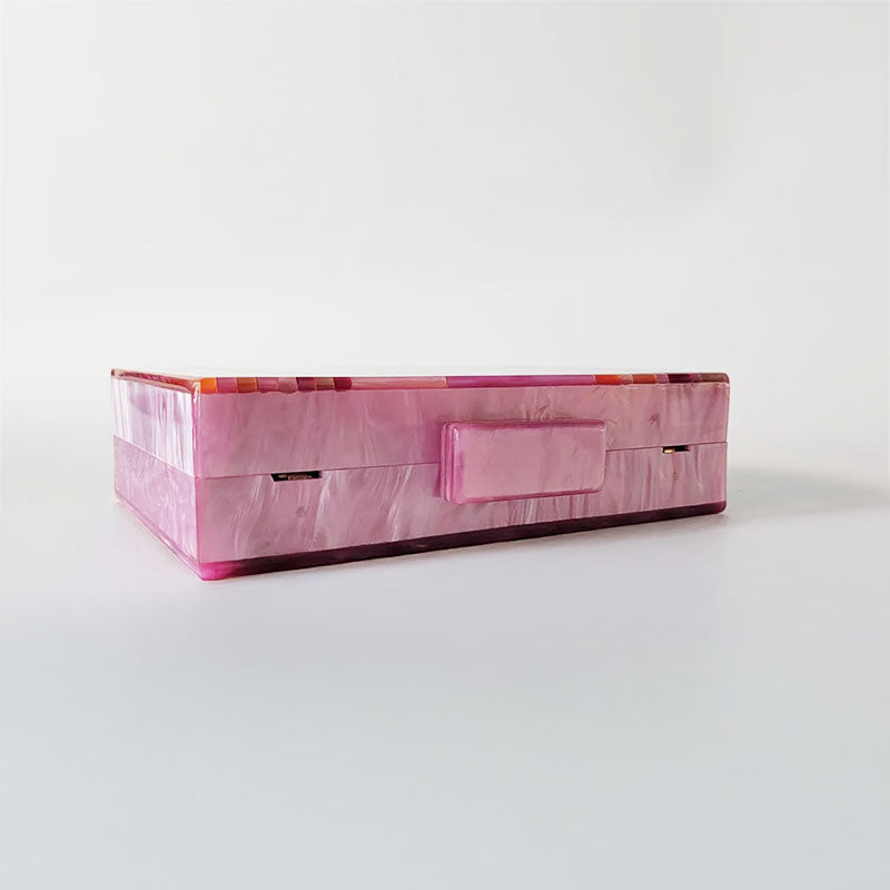Pink Mirage Acrylic Clutch Bag featuring a striped pearl acrylic finish and colourful resin chain handle – perfect for weddings, resort chic, and boho luxe outfits.