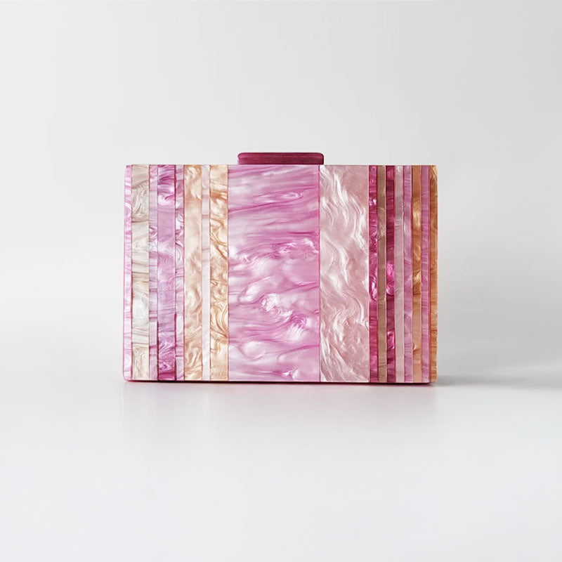 Pink Mirage Acrylic Clutch Bag featuring a striped pearl acrylic finish and colourful resin chain handle – perfect for weddings, resort chic, and boho luxe outfits.