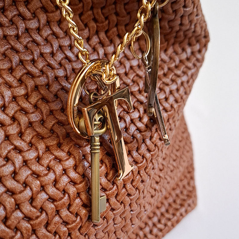 Luxurious Designer Leather Bag TL Keyluck Tote Bag in cognac leather by Montipi Australia woven leather tote bag with refined branded gold keyring