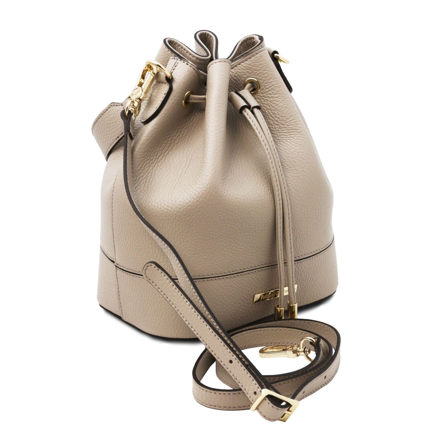 Angled view of the TL Leather Bucket Bag in beige light taupe by Montipi Australia, showcasing its premium Italian pebbled leather, structured silhouette, and elegant drawstring closure with gold-tone hardware. A versatile handbag with a detachable top handle and adjustable shoulder strap, designed for everyday sophistication and effortless style.