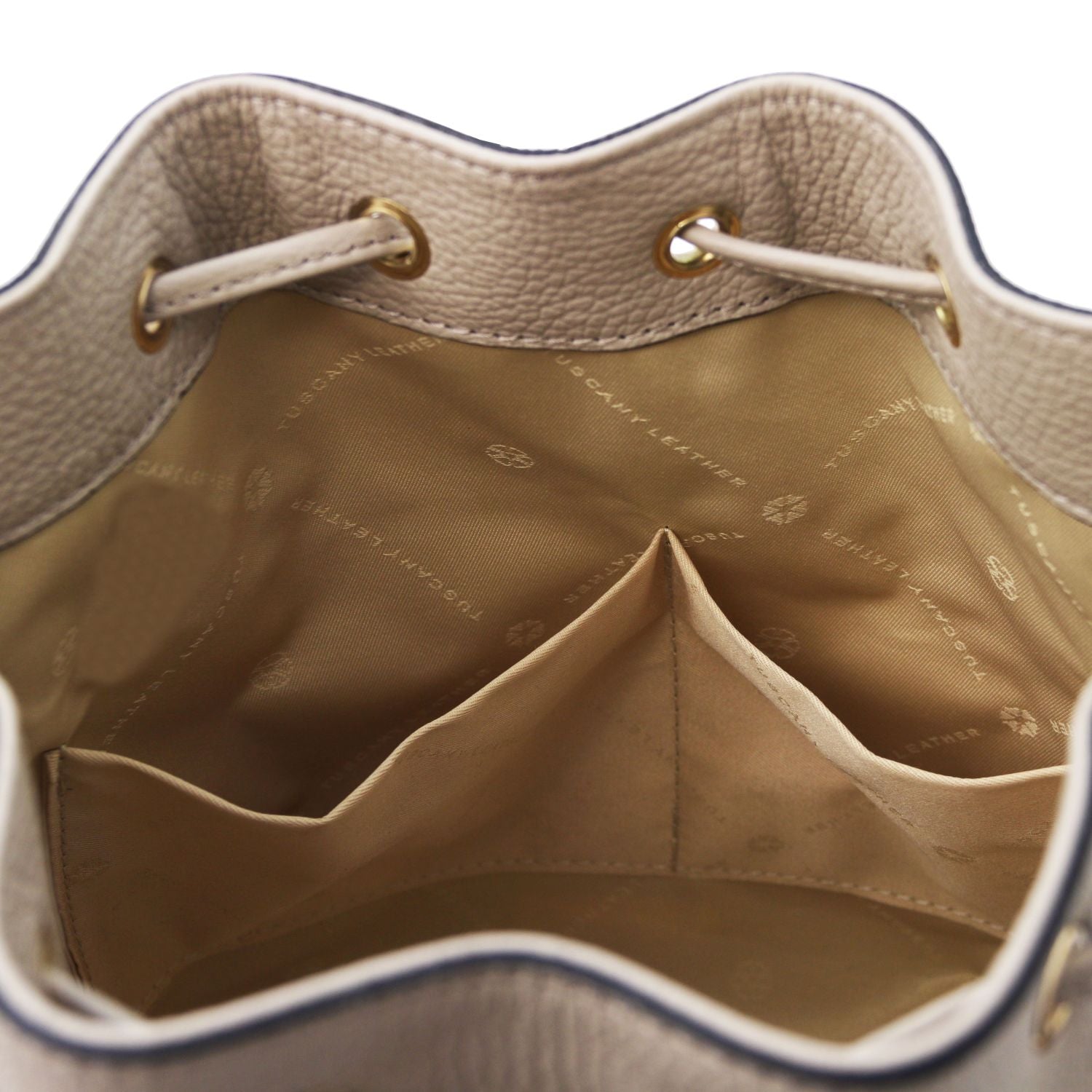Interior view of the TL Leather Bucket Bag in beige light taupe by Montipi Australia, showcasing the beige lining, dual slide pockets, and spacious compartment for effortless organization. Crafted from premium Italian pebbled leather with gold-tone hardware, this elegant bucket bag combines sophistication with practicality
