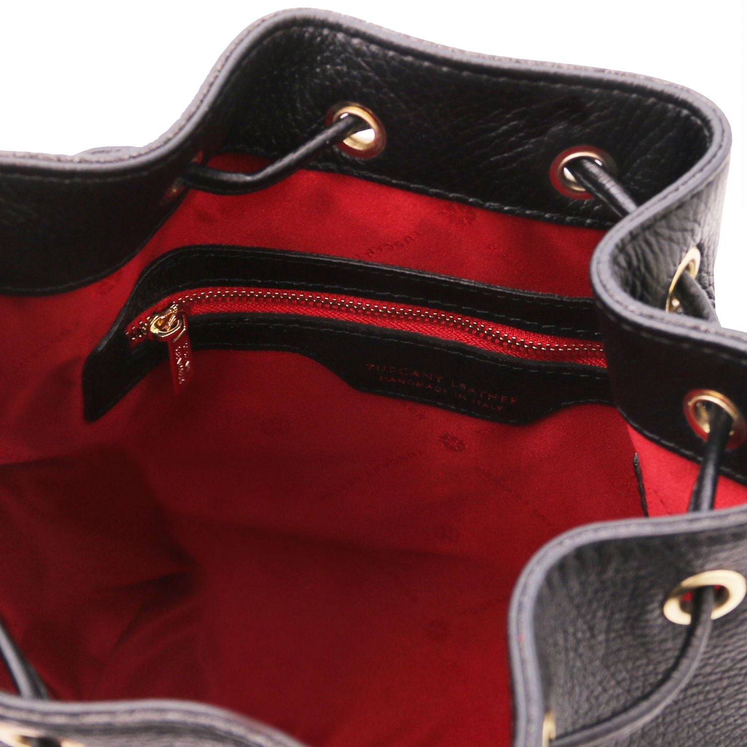 Interior view of the TL Leather Bucket Bag in black by Montipi Australia, featuring a bold red lining, spacious compartment, and secure internal zip pocket. Crafted from premium Italian pebbled leather with gold-tone hardware, this chic bucket bag blends elegance with everyday practicality.