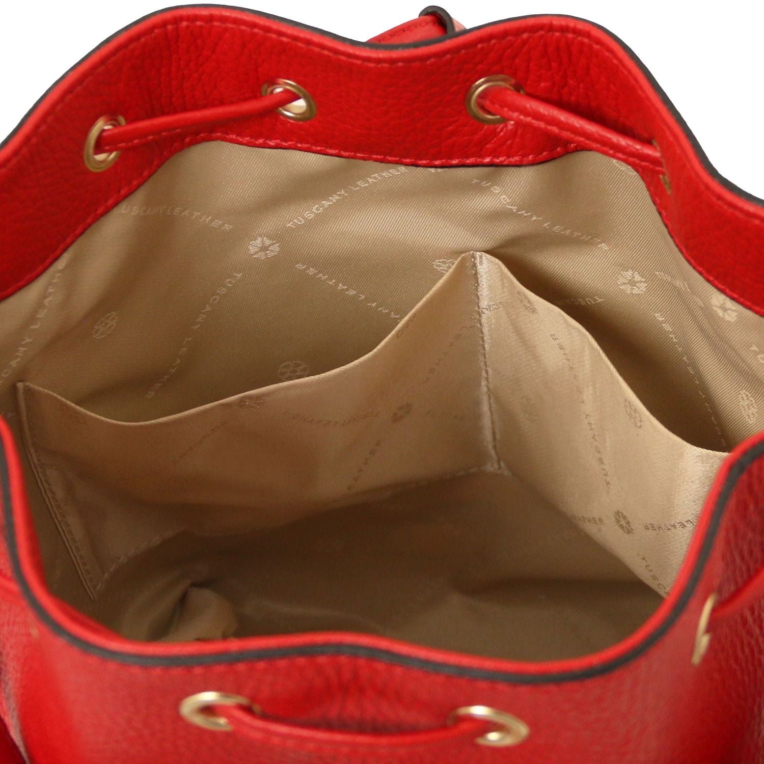 Interior view of the TL Leather Bucket Bag in red by Montipi Australia, showcasing the beige lining, dual slide pockets, and spacious compartment for effortless organization. Crafted from premium Italian pebbled leather with gold-tone hardware, this elegant bucket bag combines sophistication with practicality
