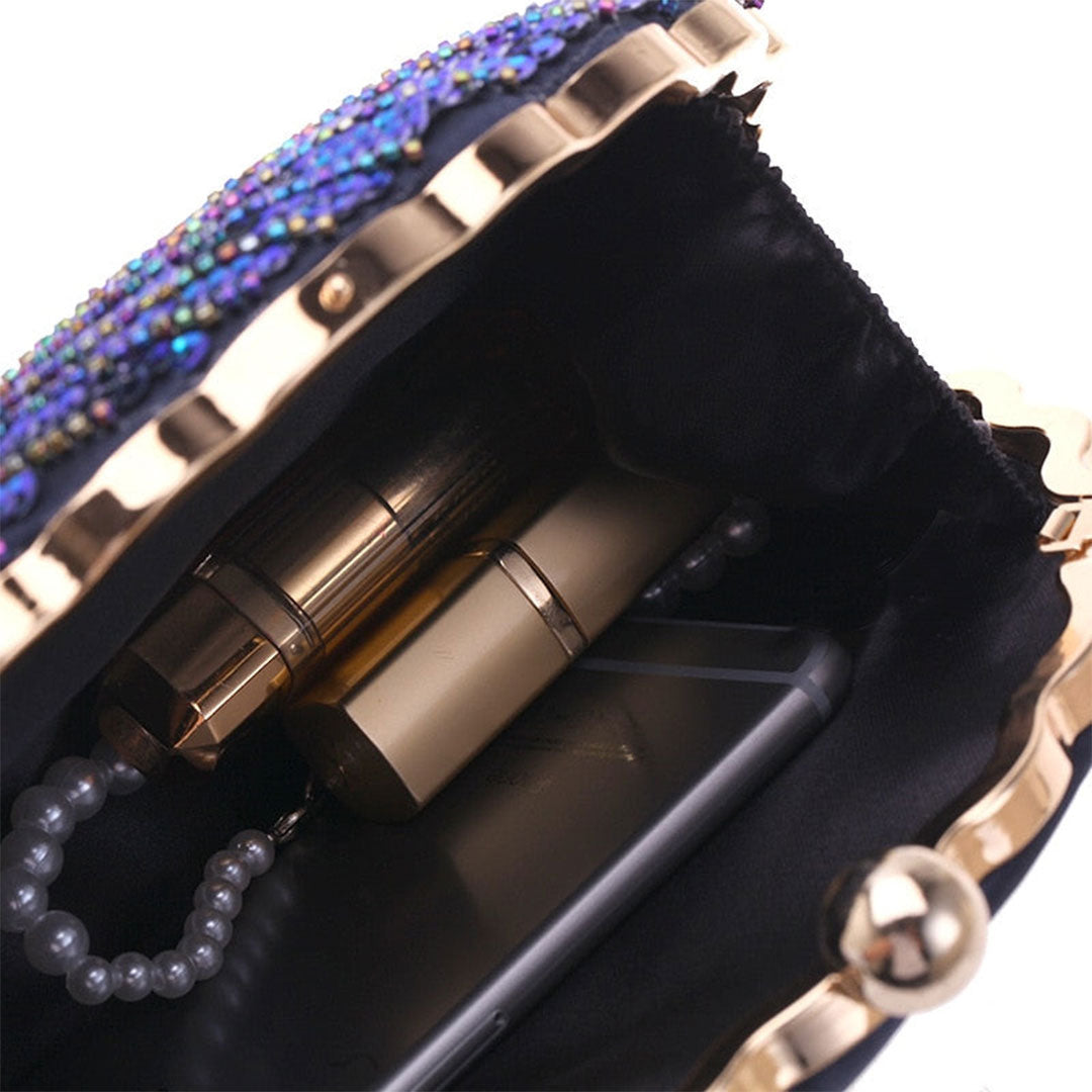 Close up on Teal Sequin Peacock Clutch with detailed beadwork design in feather shape, large interior convenient to fit all your evening essentials including lipstick, perfume, pocket mirror and smartphone, unique statement clutch bag elegant whimsical eclectic chic style by Montipi Australia