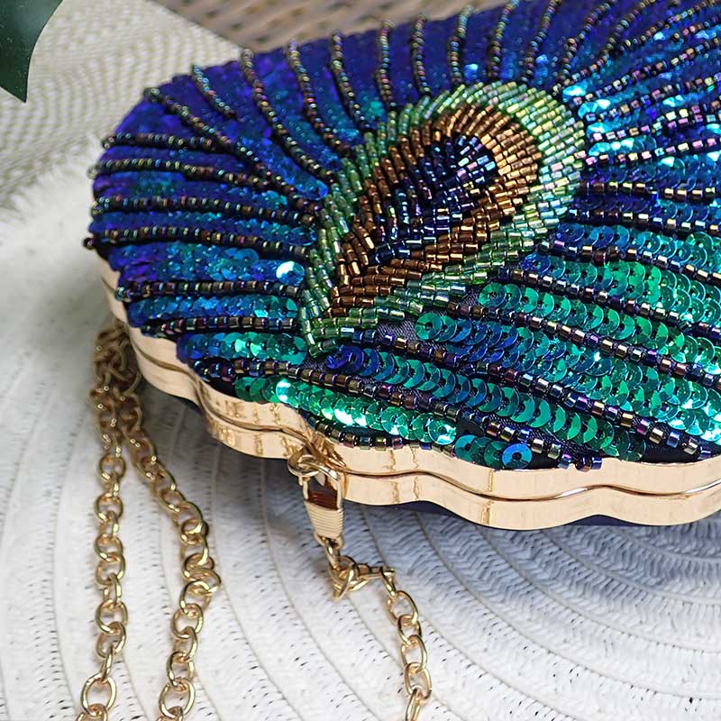 Close up on Teal Sequin Peacock Clutch with detailed beadwork design in feather shape, unique statement clutch bag elegant whimsical eclectic chic style by Montipi Australia