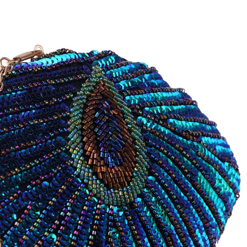 Close up on Teal Sequin Peacock Clutch with detailed beadwork design in feather shape, unique statement clutch bag elegant whimsical eclectic chic style by Montipi Australia