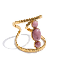 Gold bohemian gemstone ring with pink oval stones and sculptural open band design