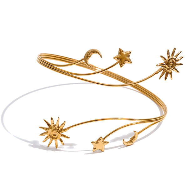 Gold celestial boho arm cuff with sun, moon and star motifs in an elegant layered silhouette