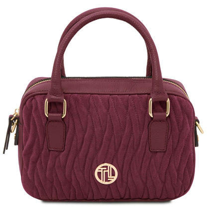 Front view of the Chantilly Suede Handbag in burgundy – a quilted suede Italian leather bag with gold-tone hardware, top handles, and a modern structured silhouette.
