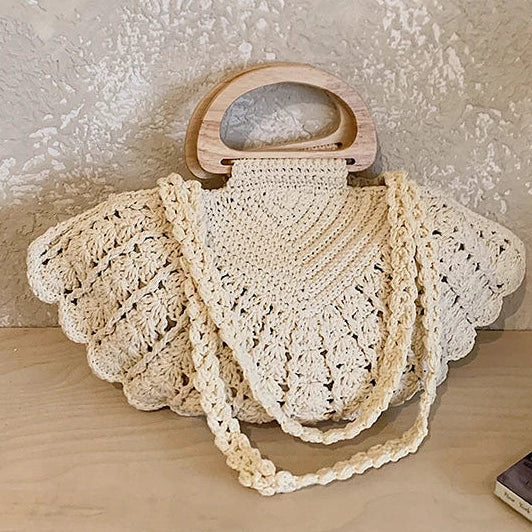 Crochet Shell Boho Bag with woven shell design, wooden handle & coastal hippie chic styling by Montipi.