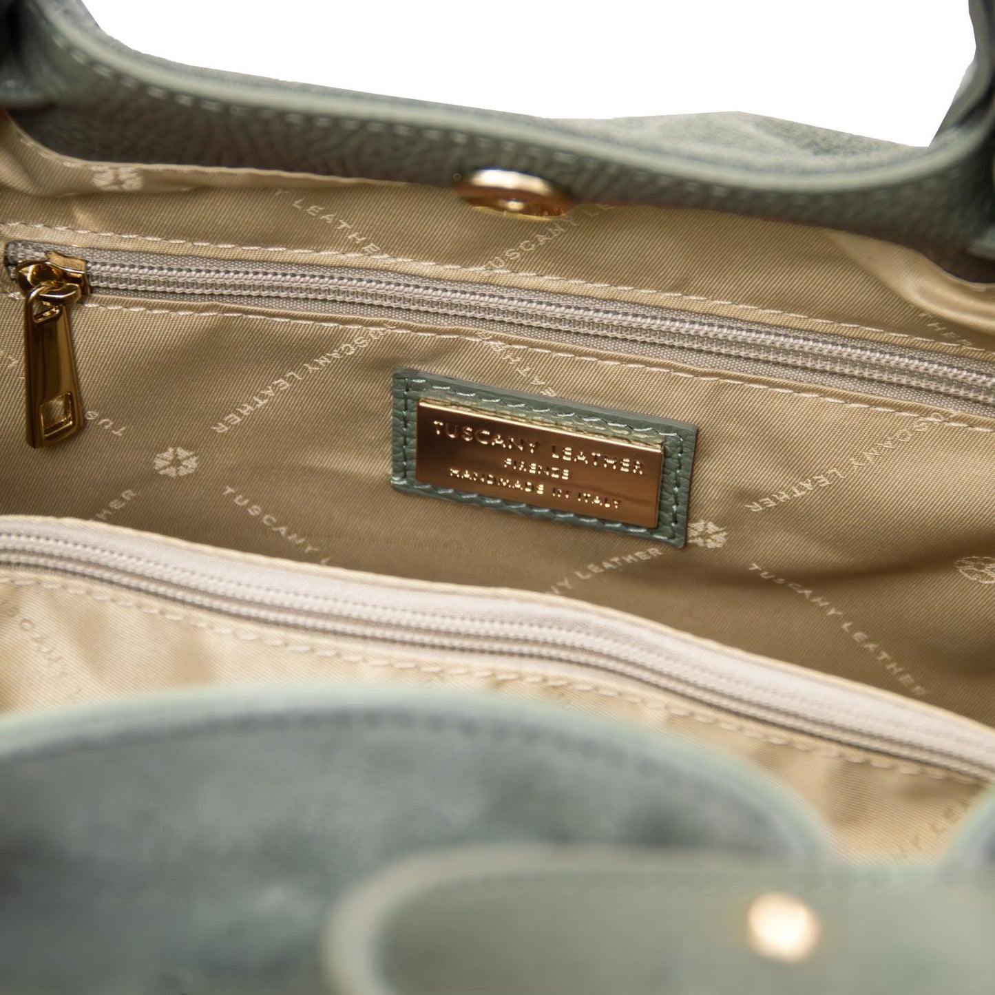 luxury TL logo in gold engraved details on Diade green suede leather shoulder bag