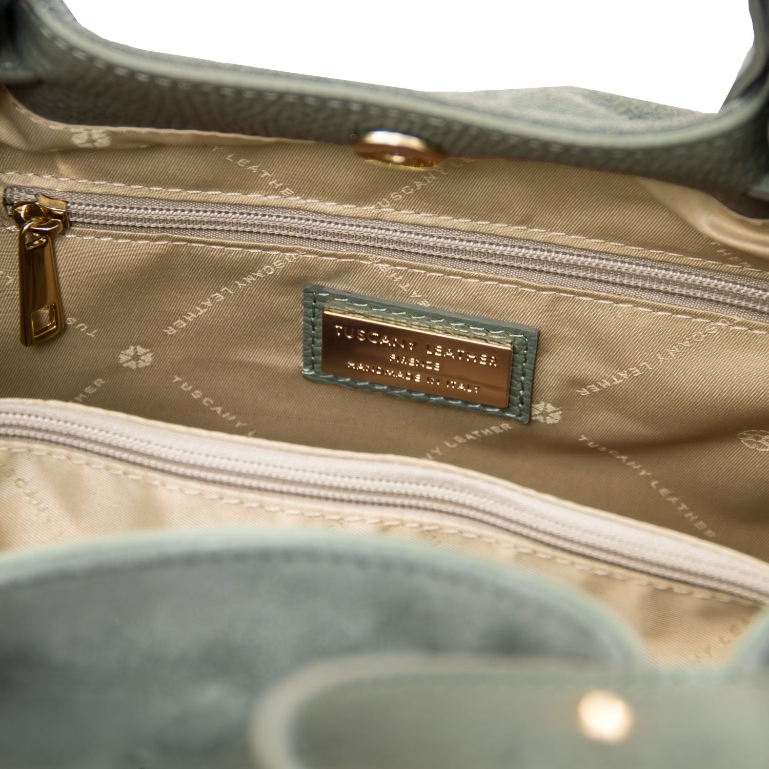 luxury TL logo in gold engraved details on Diade green suede leather shoulder bag