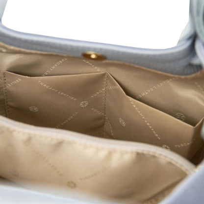 Beige interior of Diade suede leather shoulder bag with central zip compartment and pockets