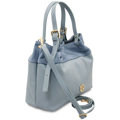 Side profile of Diade suede leather shoulder handbag in light blue