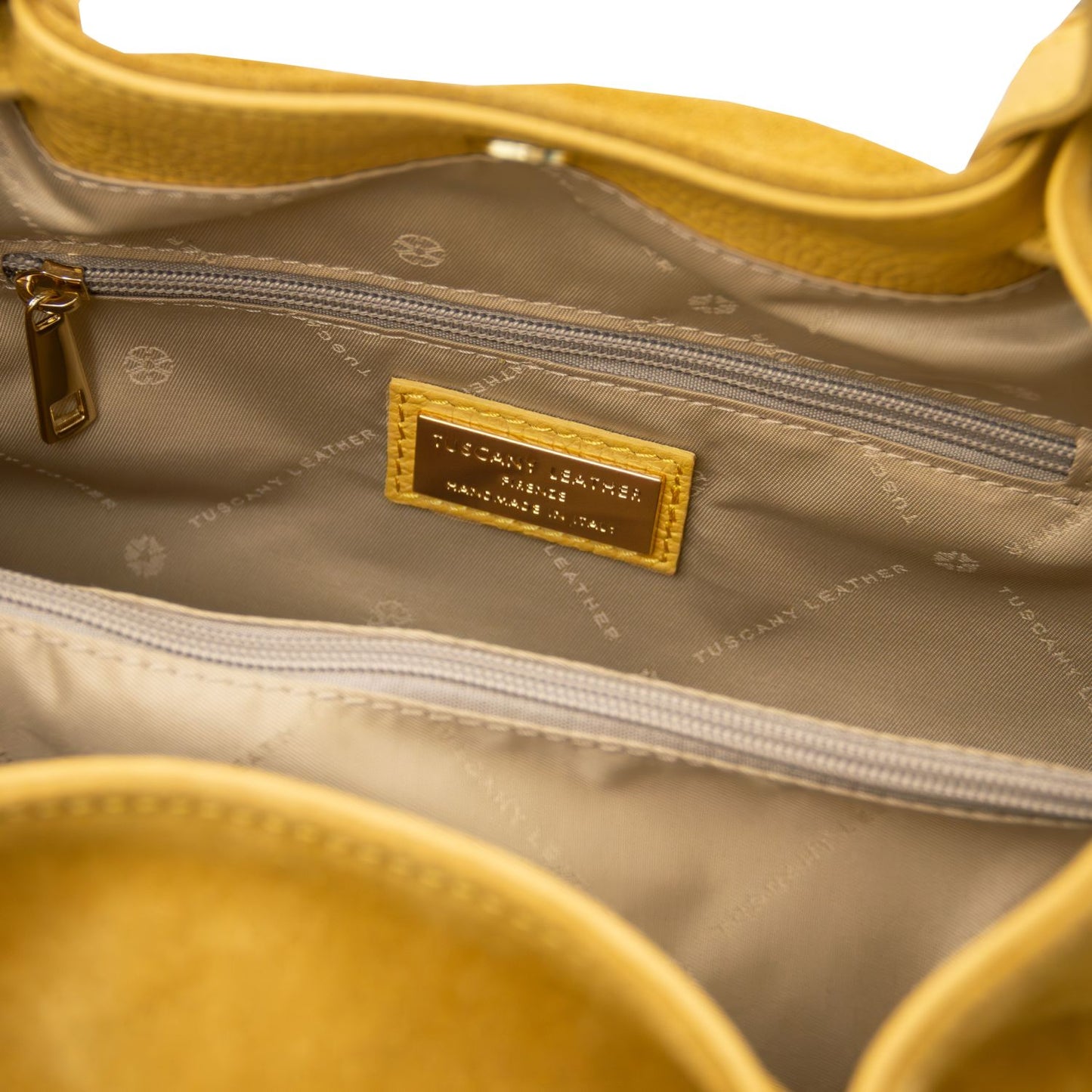 Metal TL logo detail on Diade suede leather shoulder bag