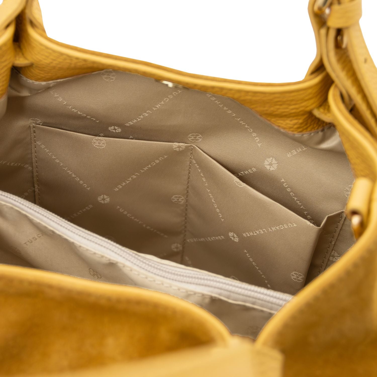 Interior of Diade suede leather shoulder bag with central zip compartment and pockets