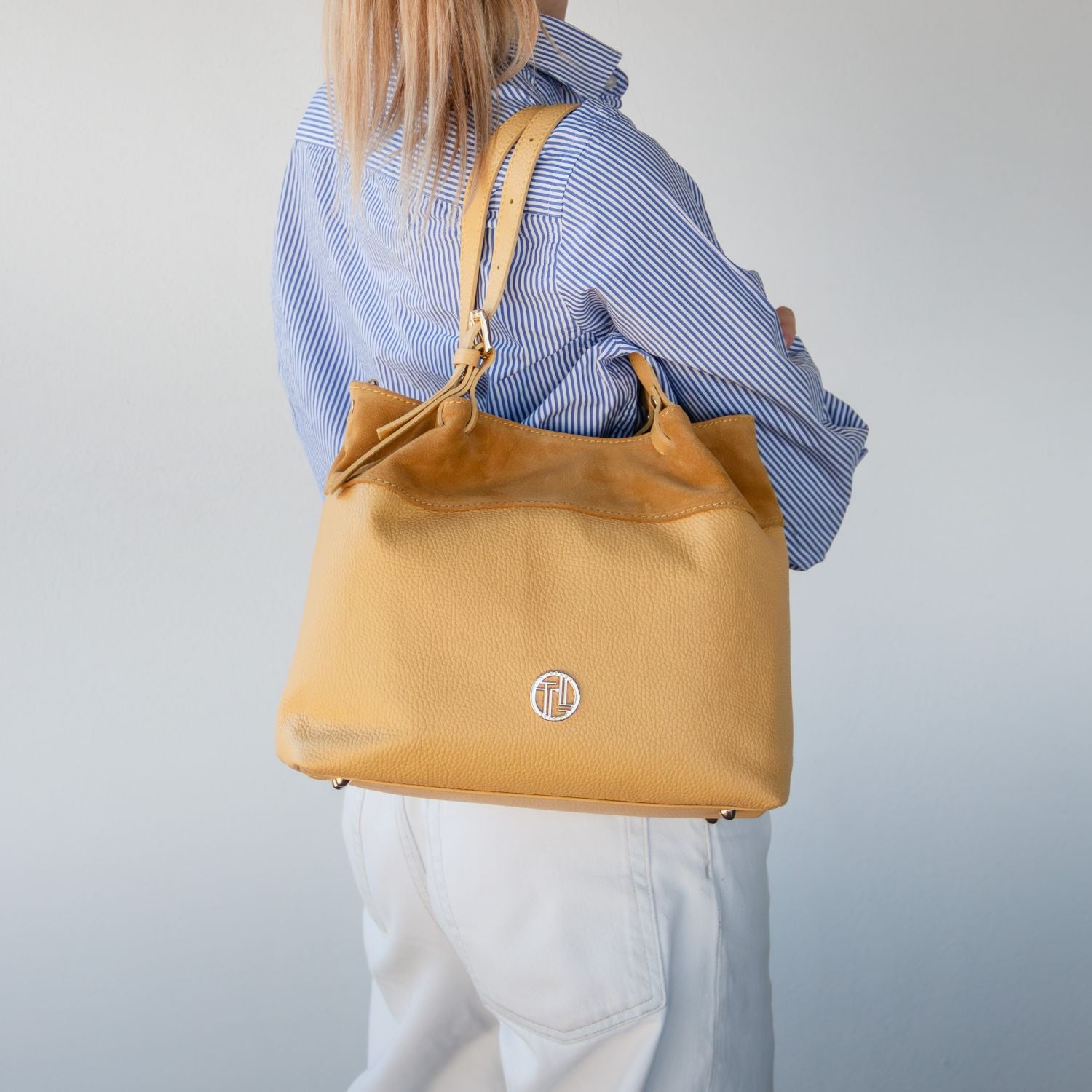 Diade suede leather handbag in yellow worn on shoulder