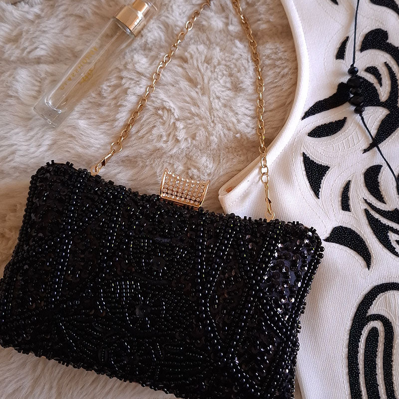 Elegant-Black-Beaded-Evening-Clutch-Bag-paired-with-black-and-white-evening-dress-and-black-jewellery-style-inspo-by-Montipi-Australia