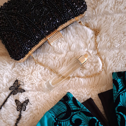 Elegant-Black-Beaded-Evening-Clutch-Bag-paired-with-couture-black-and-turquoise-evening-dress-and-black-butterfly-earrings-style-inspo-by-Montipi-Australia