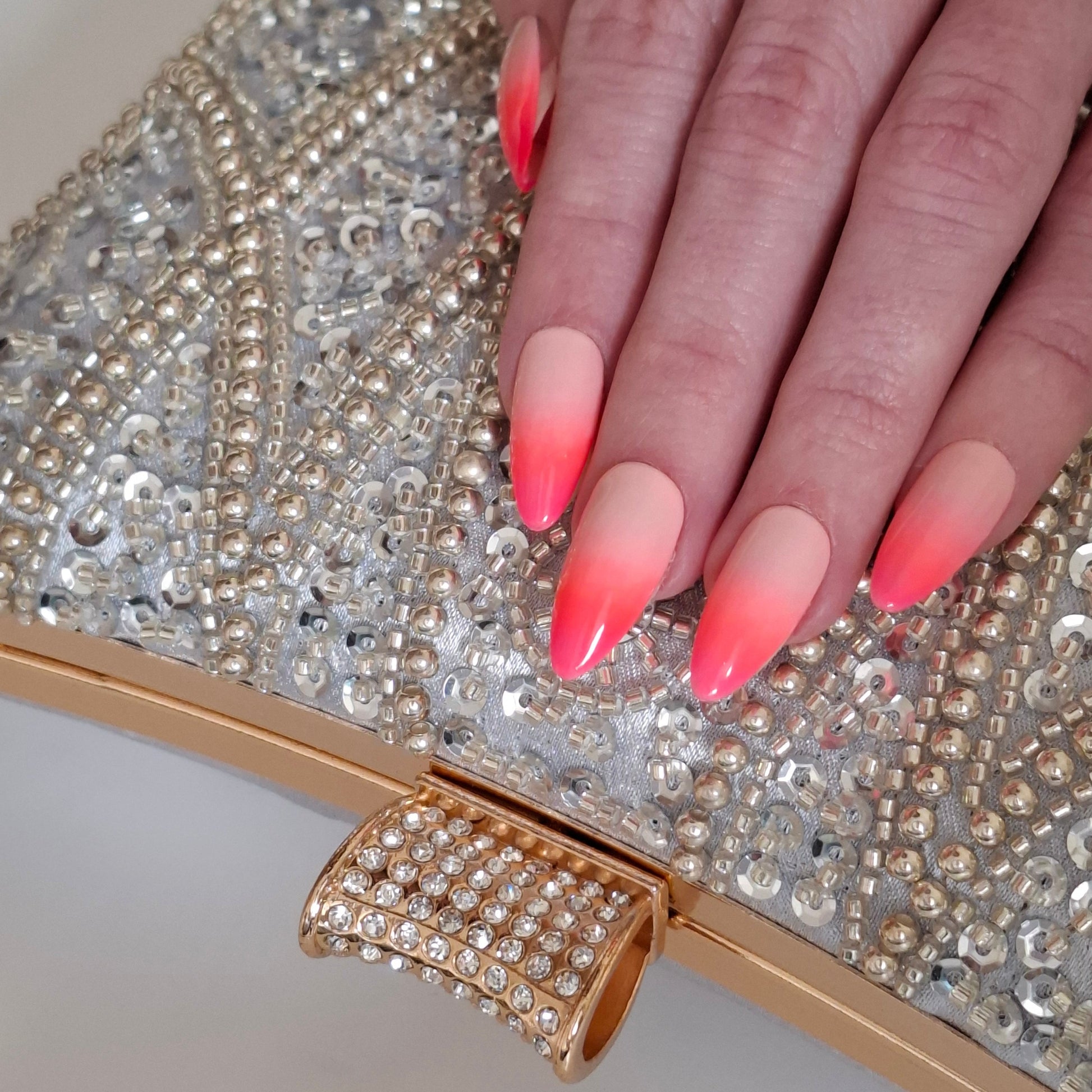 elegant silver beaded clutch bag with pink Ombre nails the perfect match by Montipi