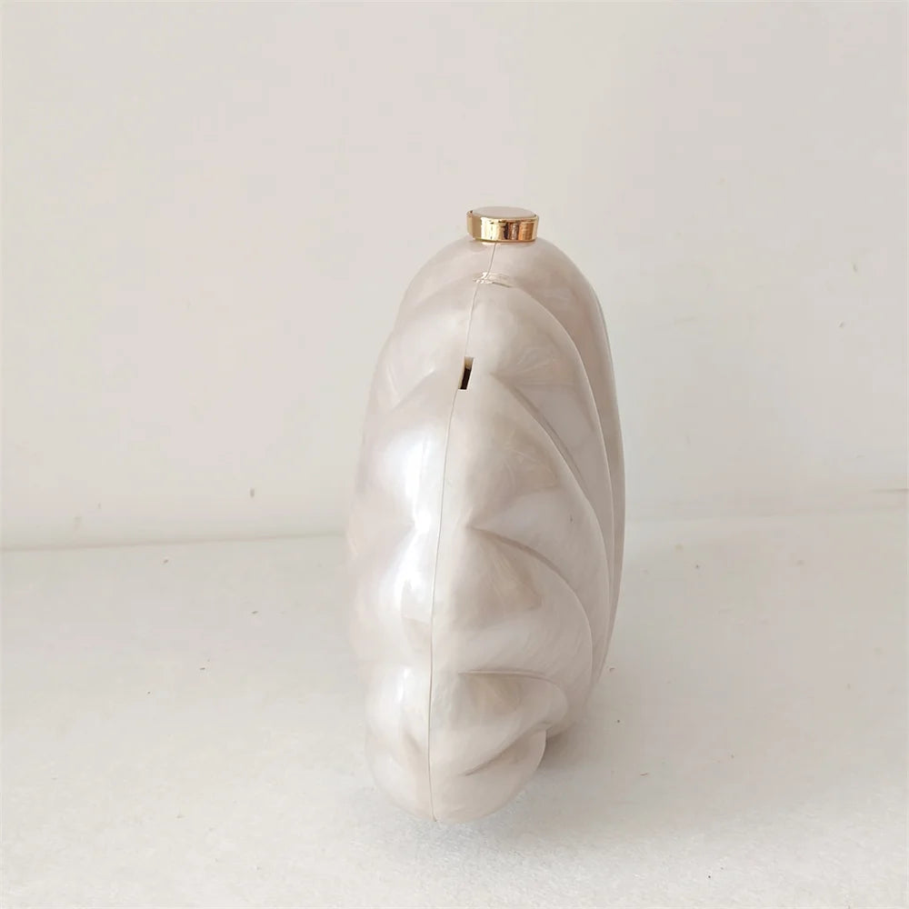 Elegant and chic Mermaid Pearl Shell Clutch Bag with removable handle and gold chain shoulder strap by Montipi Australia