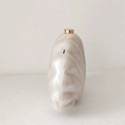 Elegant and chic Mermaid Pearl Shell Clutch Bag with removable handle and gold chain shoulder strap by Montipi Australia