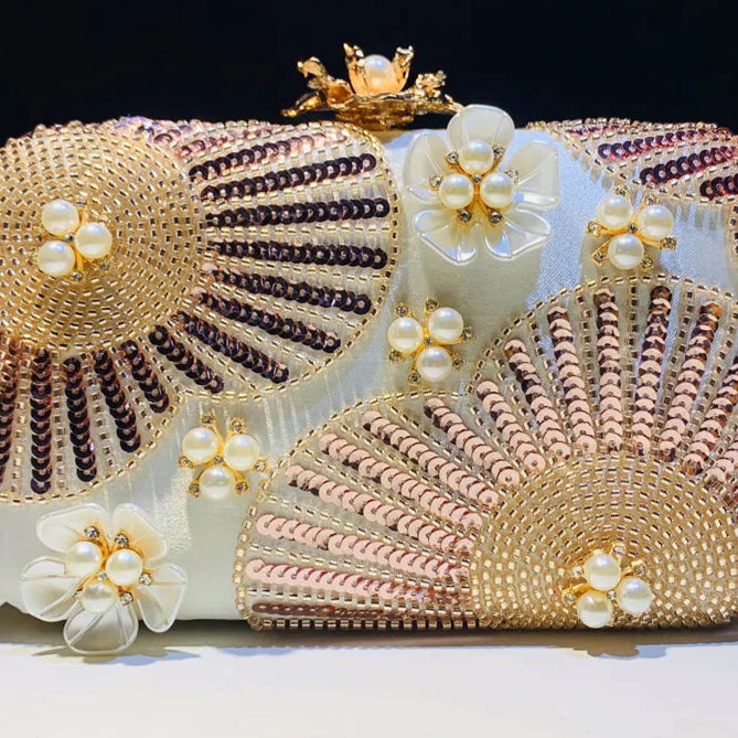 Elegant clutch bag with floral and beaded design with pearls and sequins with gold hasp a chic and dreamy statement bag to dress up for wedding or celebrations by Montipi Australia