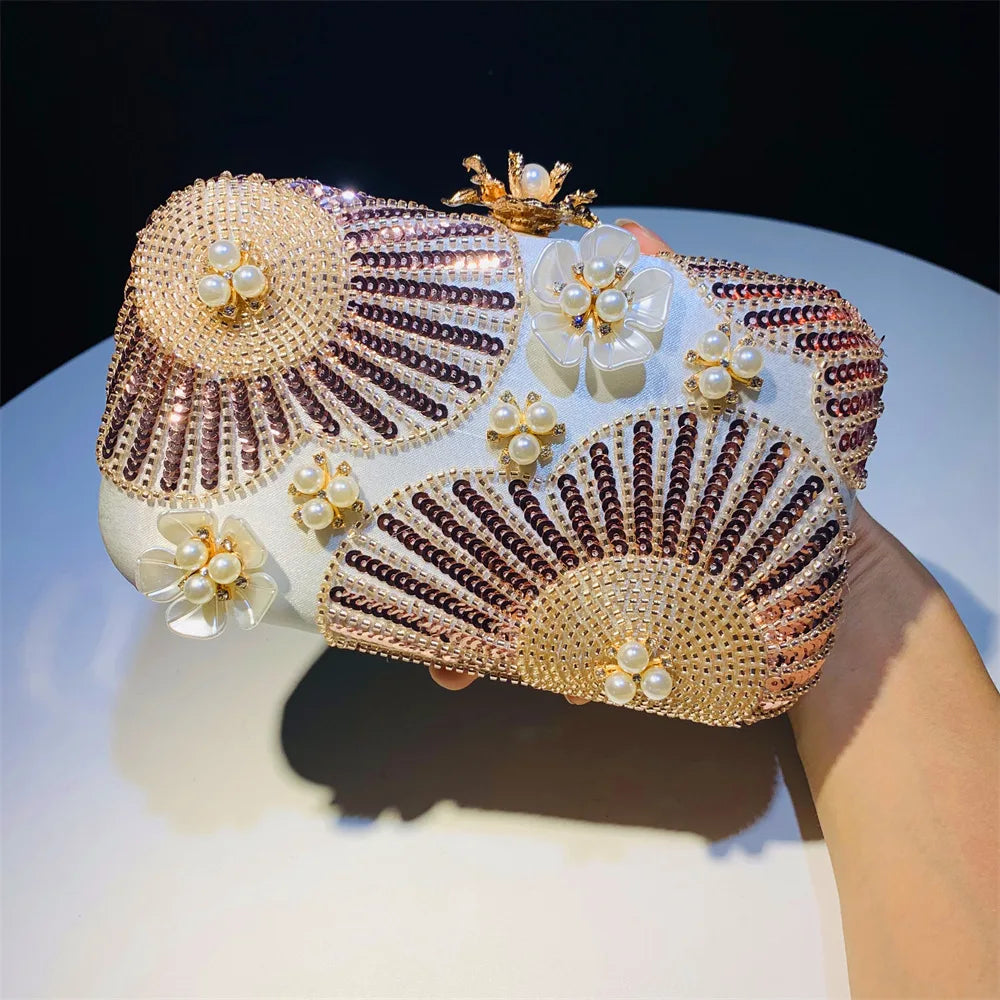 Elegant clutch bag with floral and beaded design with pearls and sequins with gold hasp a chic and dreamy statement bag to dress up for wedding or celebrations by Montipi Australia