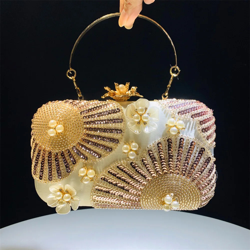 Elegant clutch bag with floral and beaded design with pearls and sequins with gold hasp a chic and dreamy statement bag to dress up for wedding or celebrations by Montipi Australia