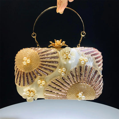 Elegant clutch bag with floral and beaded design with pearls and sequins with gold hasp a chic and dreamy statement bag to dress up for wedding or celebrations by Montipi Australia