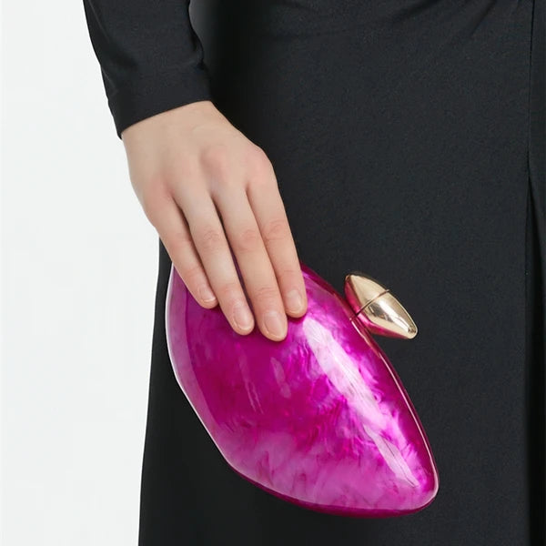 Hot pink seashell clutch bag with a dreamy pearl acrylic finish, gold hasp closure, and chain strap – perfect for weddings, soirées, and beachside style by Montipi Australia
