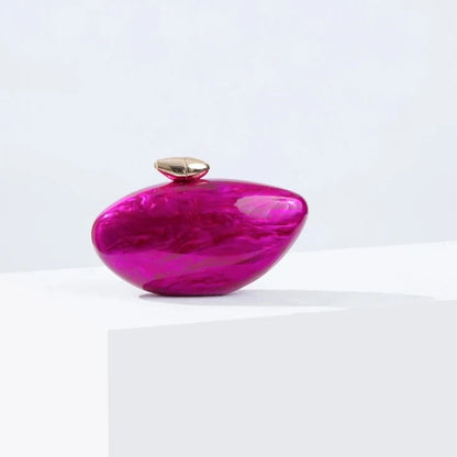 Hot pink seashell clutch bag with a dreamy pearl acrylic finish, gold hasp closure, and chain strap – perfect for weddings, soirées, and beachside style by Montipi Australia