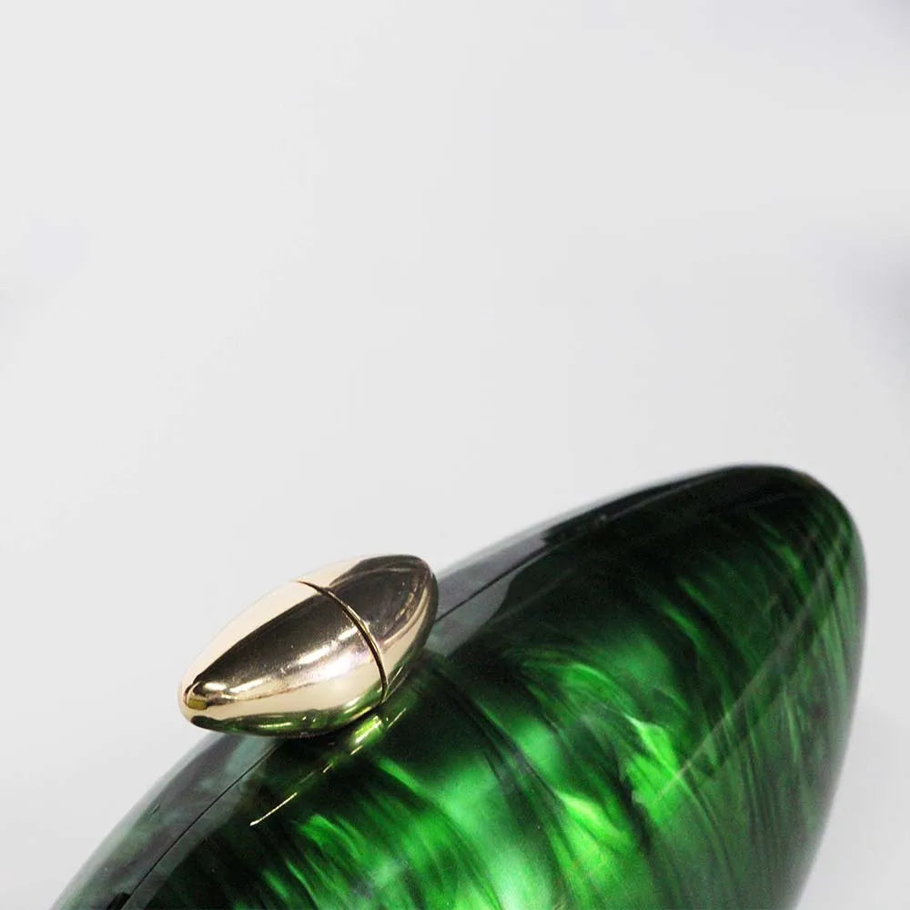 Vibrant green seashell clutch bag with a dreamy pearl acrylic finish, gold hasp closure, and chain strap – perfect for weddings, soirées, and beachside style by Montipi Australia
