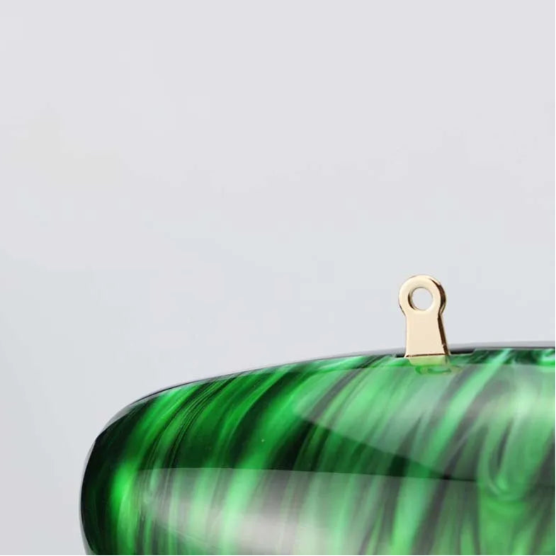 Vibrant green seashell clutch bag with a dreamy pearl acrylic finish, gold hasp closure, and chain strap – perfect for weddings, soirées, and beachside style by Montipi Australia